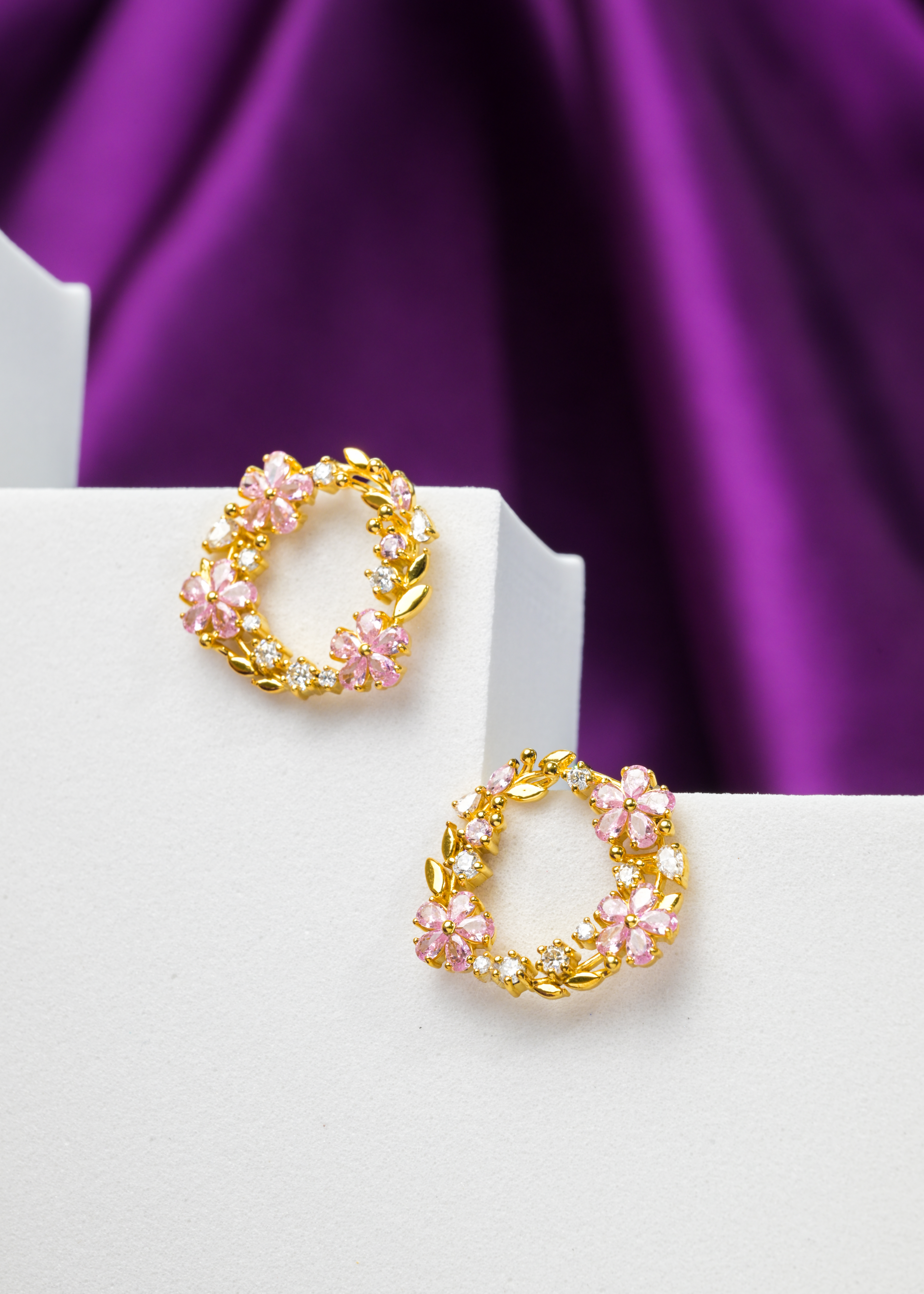 Purple floral Veesaraa earrings on display